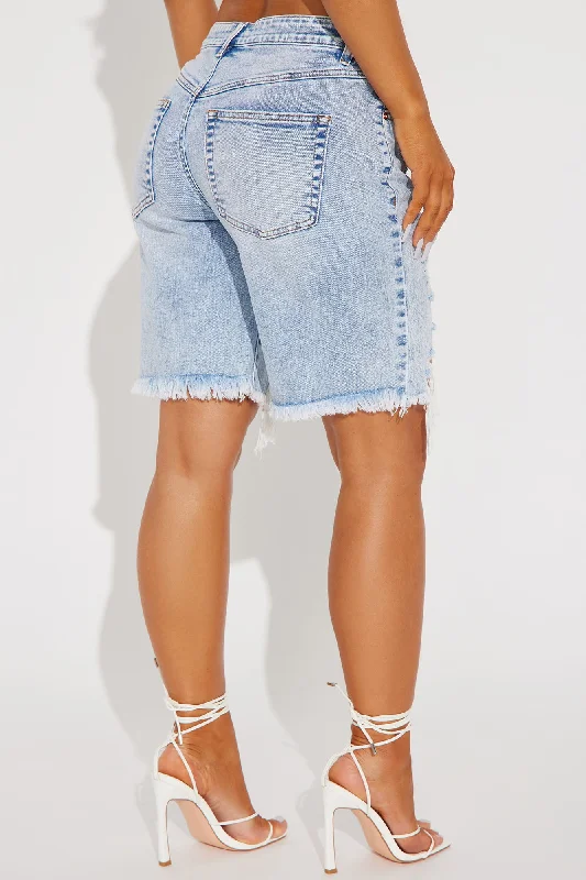 ahead-of-the-game-ripped-stretch-denim-bermuda-shorts-light-wash